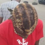 RevolutionNow: Security Operatives Shave Off Protester's Hair With Knife, Broken Bottle In Abuja 10