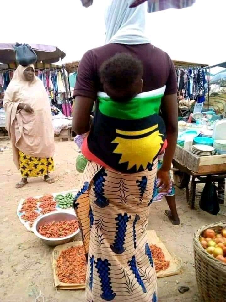 Chiwetalu Agu: Nigerians Reacts Arewa Woman Straps Her Baby With Biafra Cloth