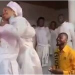 Nigerian Lady Attempts To Run As Her Man Proposes To Her During Church Service [Video]