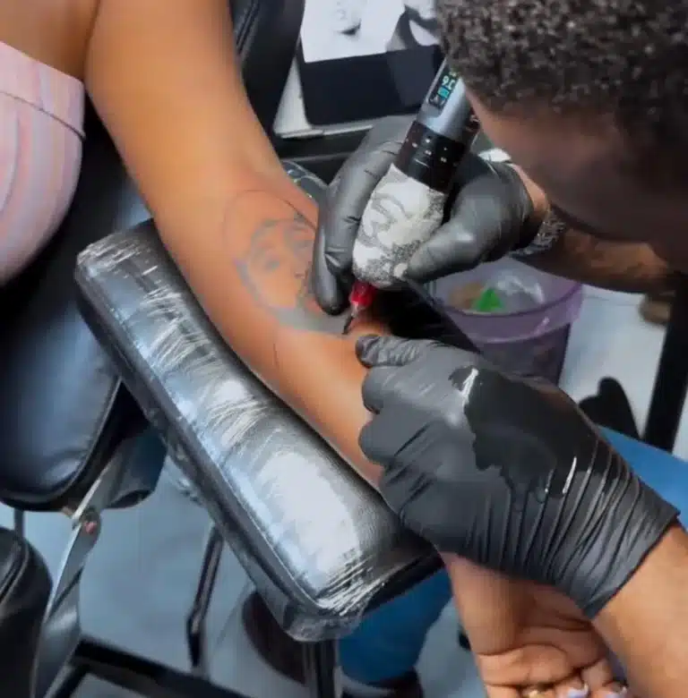 Lady Inks Tattoo Of Davido And Chioma On Both Arms To Celebrate Their Wedding [Photos]