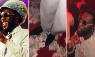 Burna Boy Caught On Camera Stepping On Naira Notes While Dancing At Nightclub [Video]