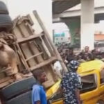 Driver Badly Injured After Truck Falls Off Bridge In Lagos [Photos]