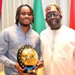 Lookman Presents CAF Footballer Of The Year Award To Tinubu In Lagos [Photos]