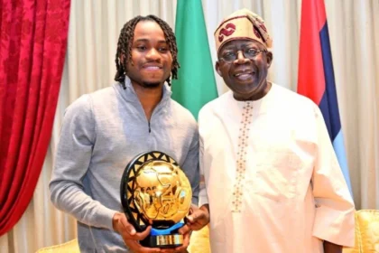 Lookman Presents CAF Footballer Of The Year Award To Tinubu In Lagos [Photos]