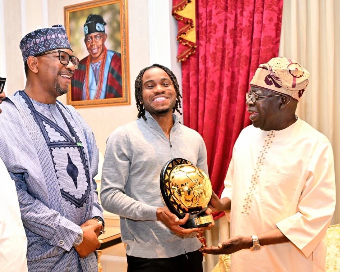 Lookman Presents CAF Footballer Of The Year Award To Tinubu In Lagos [Photos]
