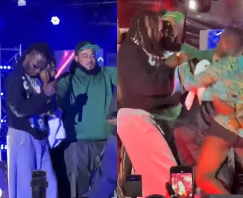 Reactions As Man Attack Naira Marley While Performing On Stage In Cotonou [Video]