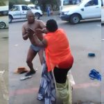 Woman Strips Off Her Husband’s Cloths As They Publicly Fights Dirty On The Streets [Photos] 2